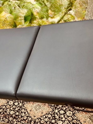 Portable folding massage bed with vinyl mattress, wooden frame