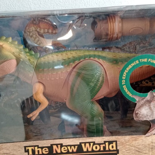 Dinosaur toy like new, in original box with minor wear
