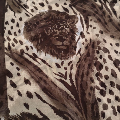 African pareo with wild feline print used, leopard and tiger patterns