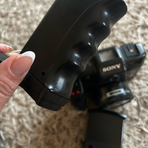 Sony camera like new with handle, flash, and bag