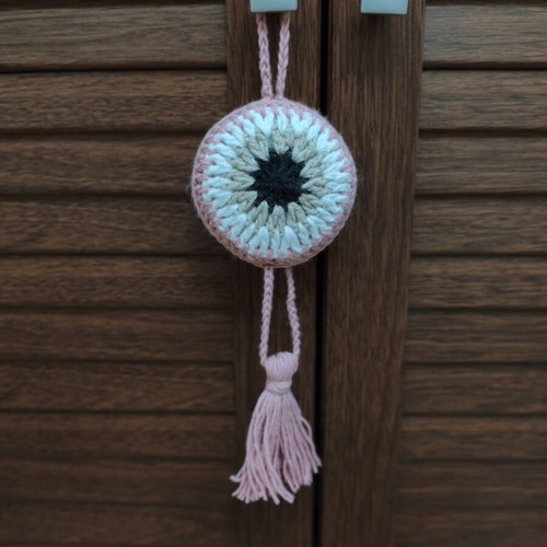 Handmade knitted eye for stroller or cradle, rose color, diameter 8.5 cm