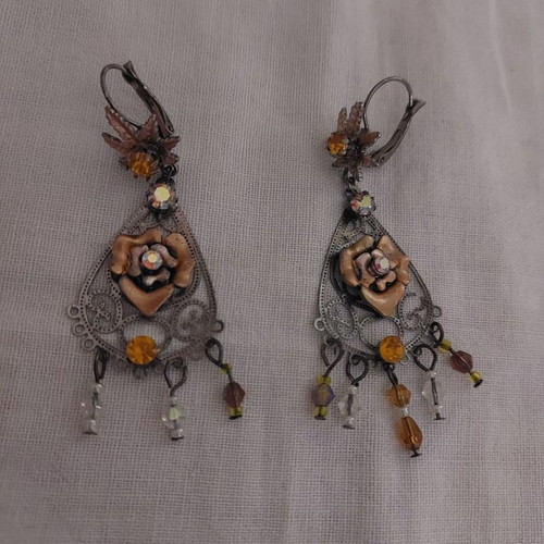 Earrings used with stones, missing 2 rows on one