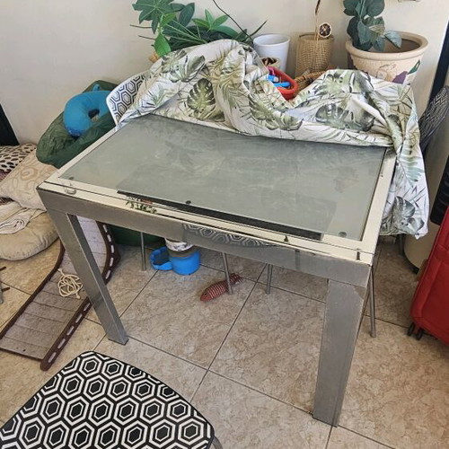 Metal dining table with glass top and 4 chairs used, extends to 8