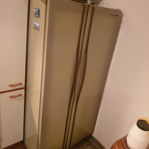 Vintage 1970s home appliance set used, General Electric fridge, Kenmore stove, Ariston washer