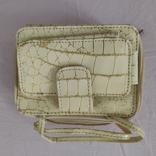 Small gold wristlet shoulder bag