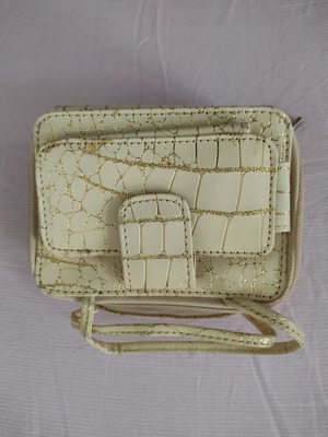 Small gold wristlet shoulder bag