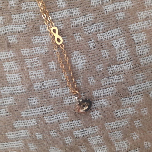 Short necklace with eye and infinity symbol new, gold color