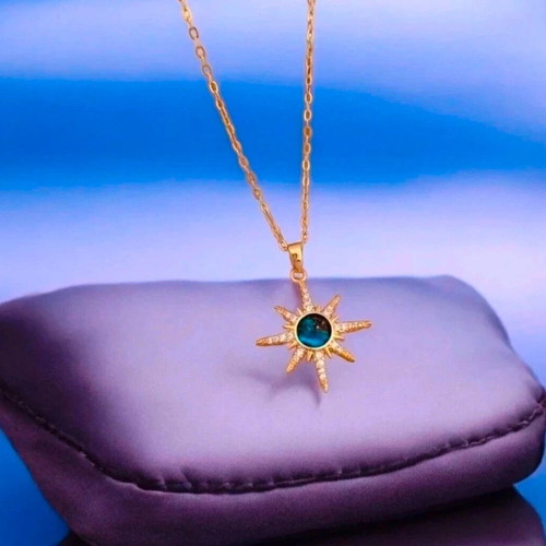 Steel necklace new with blue stone and gold details