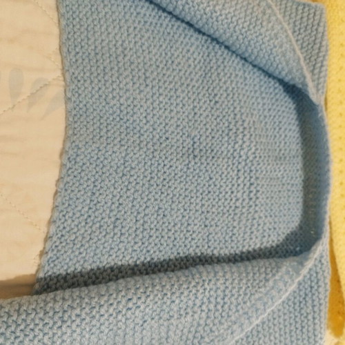 Handmade knitted baby sleeveless cardigans, yellow and blue