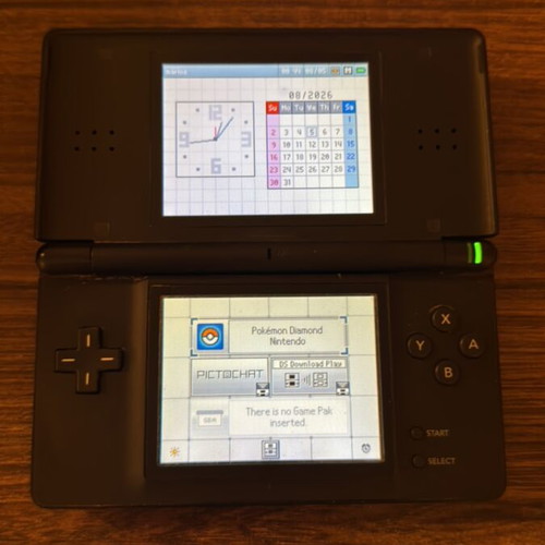 Nintendo DS Lite console like new with leather case and 2 Pokémon cartridges