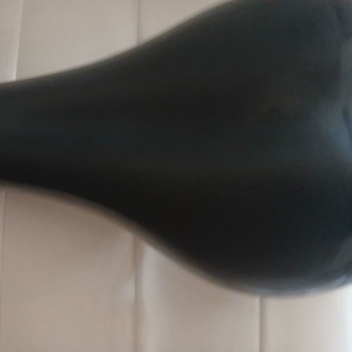 Carrera bicycle saddle like new with integrated rail clamp black