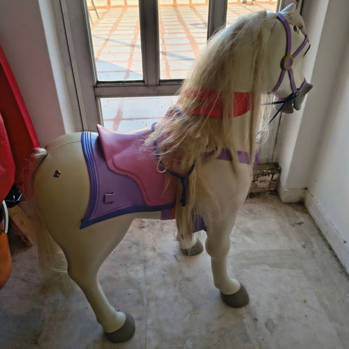 Jakks Pacific Maximus rocking horse toy with sounds used, colorful