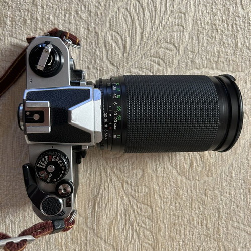 Nikon FM2 35 mm camera used with Telezon telephoto lens and lens cap