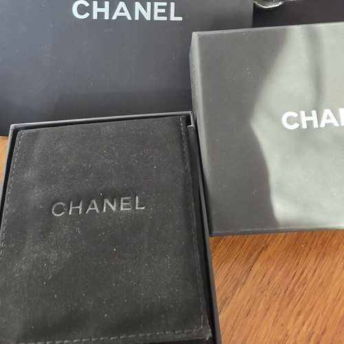 Chanel earrings with white and gold details