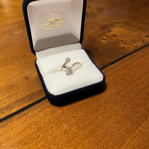 Women's 14K gold ring like new with round cut and pear-shape stones