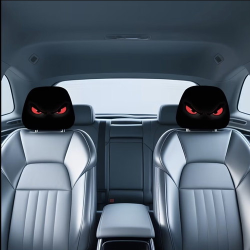 Car headrest covers with red devil eyes pattern, like new, set of 2