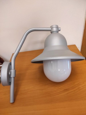 Wall-mounted cast outdoor sconce
