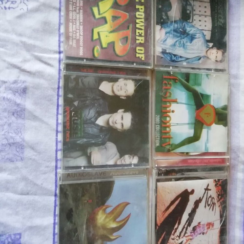 CD discs collection with Audioslave, Muse, The Power Of Rap, Korn, Fashion TV, Alexander