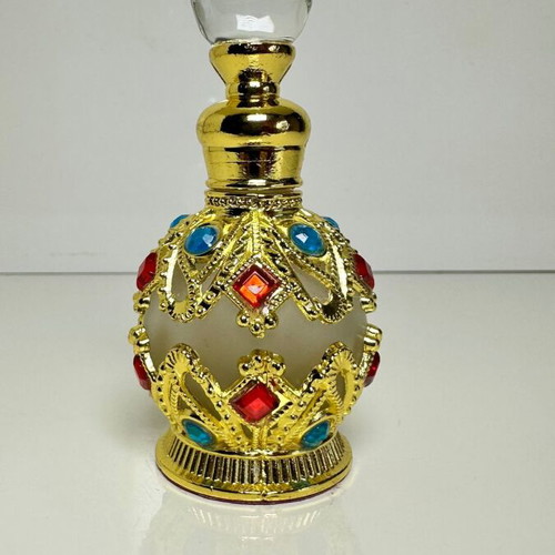 Vintage Arabic perfume bottle with gold metal frame and stones