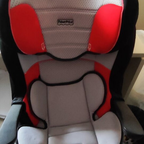 Fischer Price car seat used for child with car belt fastening