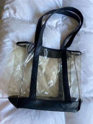 PVC shoulder bag used with transparency and black details