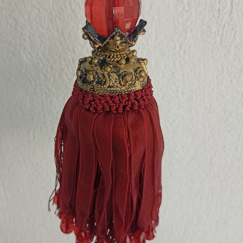 Red fabric decorative tassel used with hanging ornament gift