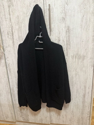 Knitted cardigan like new, black, hooded, without buttons