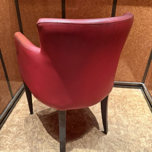Red armchair with armrests, modern design