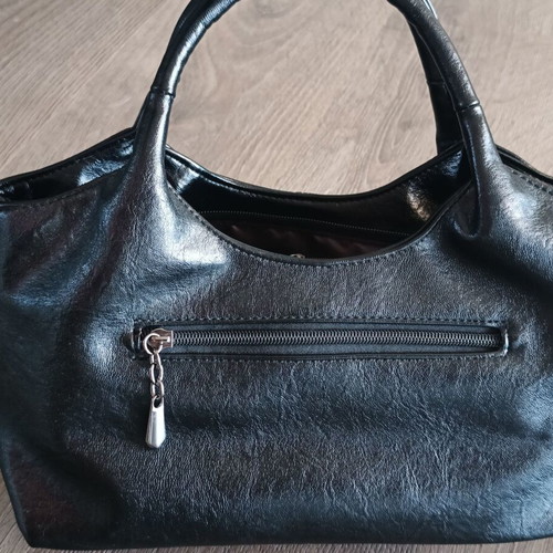Handbag new with strap, black synthetic leather