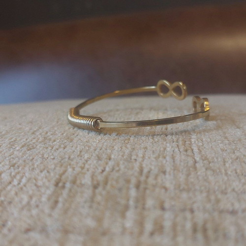 Gold infinity handcuff bracelet like new