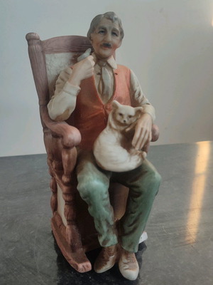 Italian porcelain figurine man with cat used, 1960s