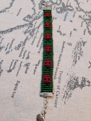 Beaded bracelet like new with ladybug design