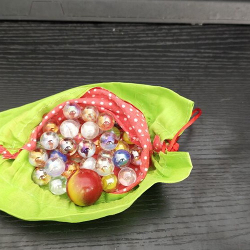 Fabric pouch with colorful glass marbles like new