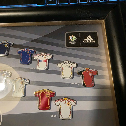 Set of collectible pins with Adidas jerseys like new