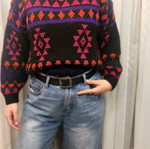 Black sweater with patterns used, multicolored