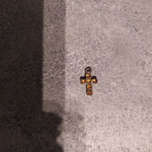 Cross pendant used with small diamonds gold and silver