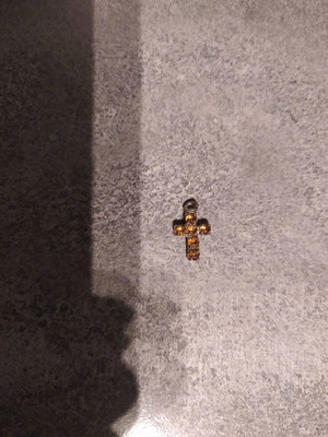 Cross pendant used with small diamonds gold and silver