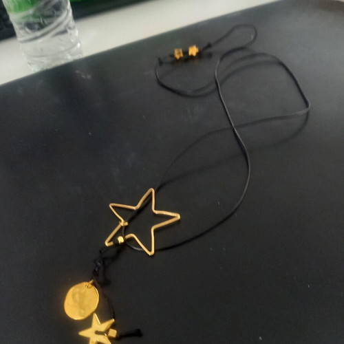 Pendant like new with subtle black and gold details