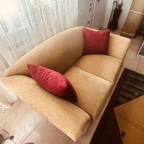 Two-seater sofa like new with elegant design and beige upholstery