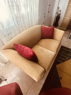 Two-seater sofa like new with elegant design and beige upholstery