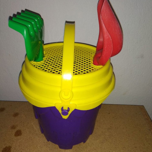 Sand bucket used with shovel, rake and 4 toy cars