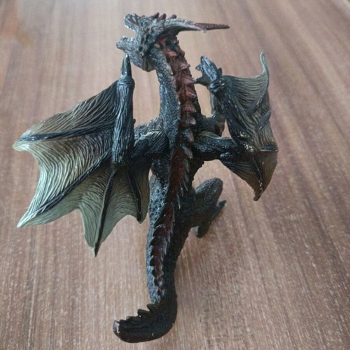 Dragon used, 11cm tall, missing finger on right hand