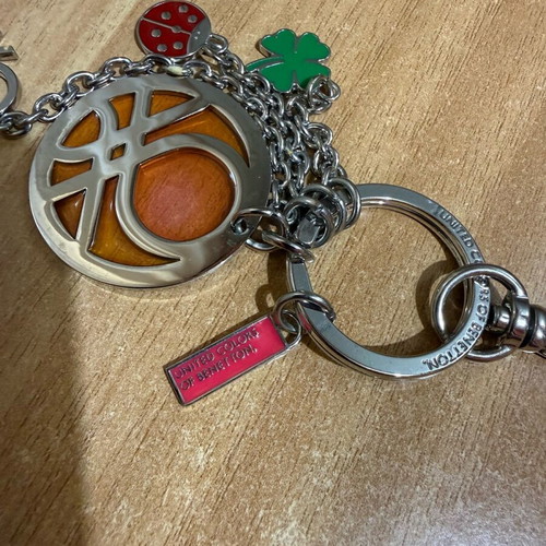 United Colors of Benetton silver keychain like new