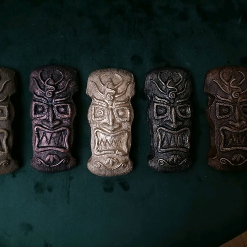 Handmade gypsum magnets and hanging totems painted with acrylics