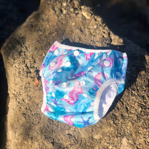 Swim diaper with seahorse and starfish pattern like new, multiple sizes