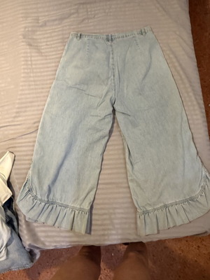 Denim pants with ruffles, light blue
