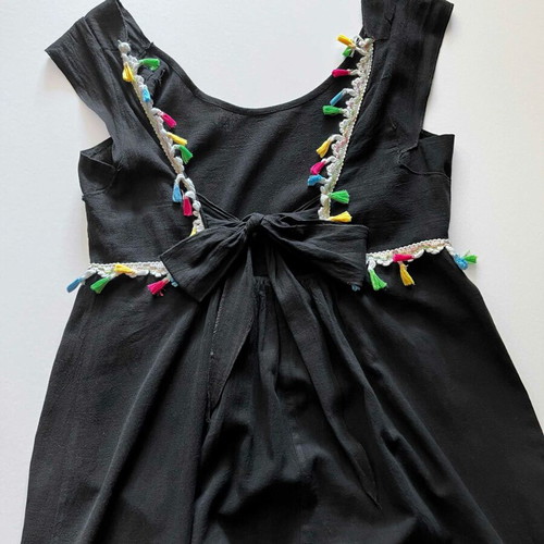 Dress with open back and bow used, black with colorful tassels