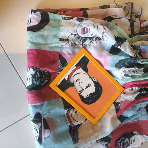 Pop art patterned curtain and orange wooden frame