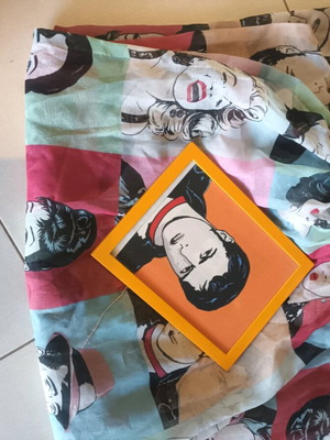 Pop art patterned curtain and orange wooden frame
