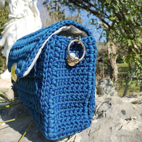 Handmade knitted shoulder bag blue, lined with gold details